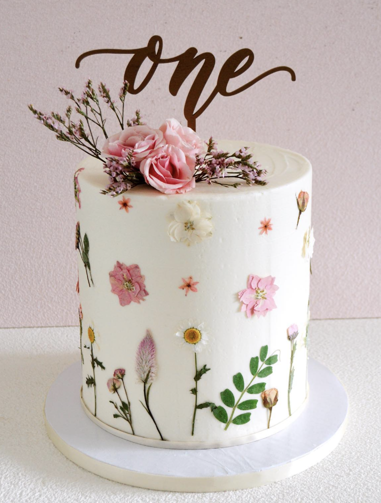 floral first birthday cake